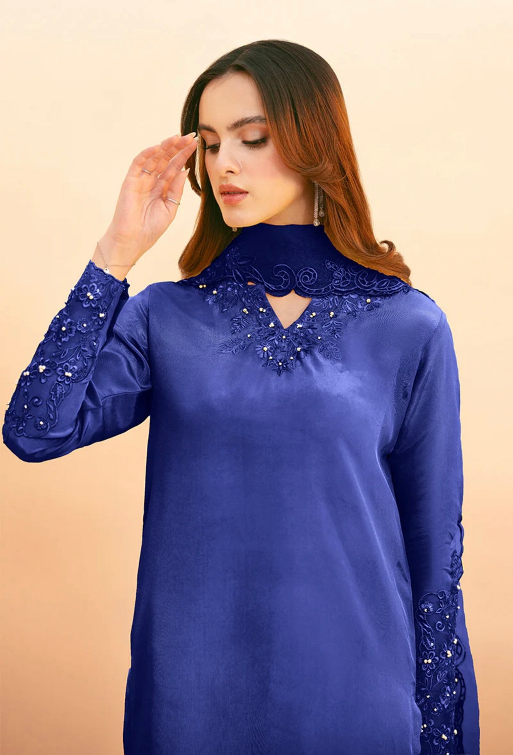 Royal blue palazzo suit by Armas featuring intricate lace and sequin detailing on the neckline and cuffs.