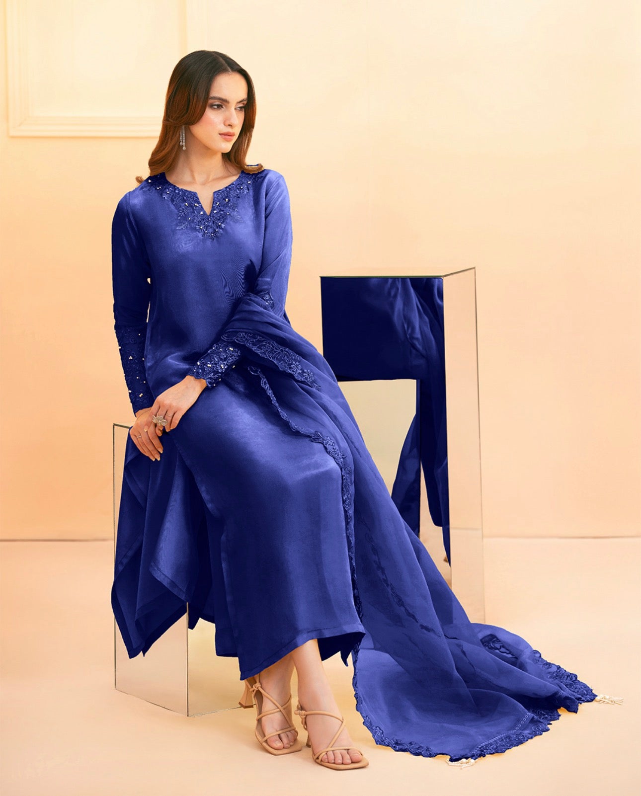 Royal blue palazzo suit by Armas featuring intricate lace and sequin detailing on the neckline and cuffs.